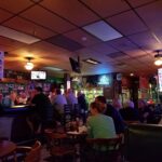 Local patrons enjoying the game and a cold beer at Sandy's Beef and Ale