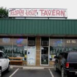 Exterior sign for Happy Hour Tavern on Veterans Highway