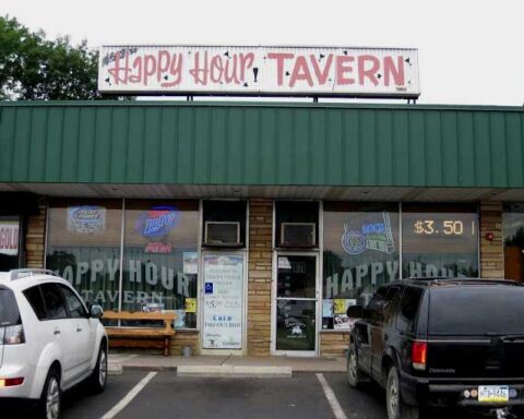 Exterior sign for Happy Hour Tavern on Veterans Highway